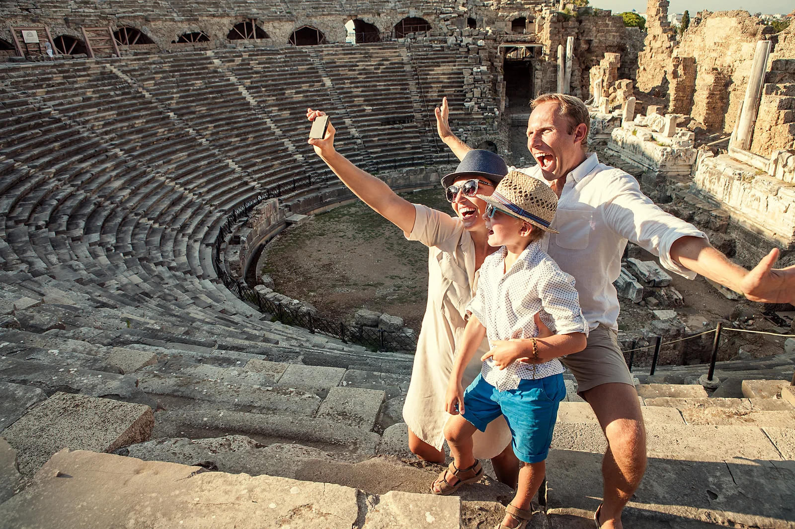 A family enjoying a visit to an ancient amphitheatre in Turkey